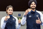 Manu Bhaker latest, Manu Bhaker medals, manu bhaker makes olympics history for india with second bronze, Carolina marin