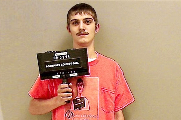 Man wears something special for jail booking photo},{Man wears something special for jail booking photo